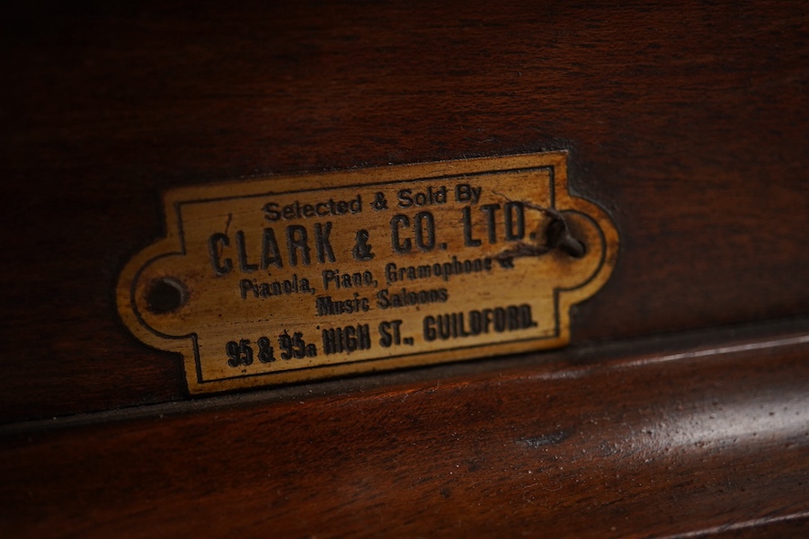 An HMV tabletop mahogany gramophone player with large laminated wooden horn, diameter of horn 55cm. HMV transfer labels to both body and horn. Condition - fair.